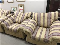 Lot 15 - RED AND FLORAL UPHOLSTERED THREE SEATER SETTEE
