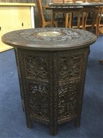 Lot 181 - EASTERN CARVED WOOD TABLE WITH FOLDING BASE