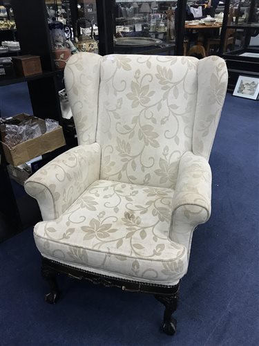 Lot 97 - A WINGBACK CHAIR OF CHIPPENDALE DESIGN