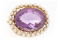 Lot 12 - AN AMETHYST AND SEED PEARL BROOCH