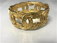 Lot 14 - A GOLD PLATED CHANEL BANGLE