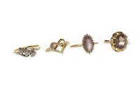 Lot 16 - A DIAMOND THREE STONE RING AND THREE OTHERS