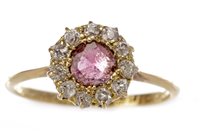 Lot 211 - A RED GEM STONE AND DIAMOND CLUSTER RING