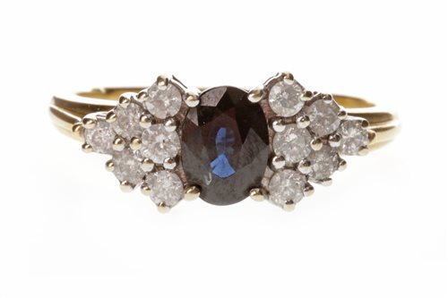 Lot 214 - A BLUE GEM AND DIAMOND RING