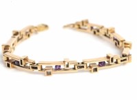 Lot 1635 - NINE CARAT GOLD AMETHYST BRACELET the pierced...