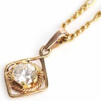 Lot 1640 - DIAMOND SOLITAIRE PENDANT the brilliant cut...