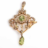 Lot 1667 - PERIDOT AND SEED PEARL HOLBEIN of openwork...