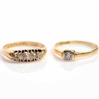 Lot 1668 - TWO DIAMOND RINGS comprising a solitaire ring...