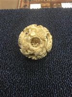 Lot 1017 - A CHINESE IVORY CONCENTRIC BALL AND A FIGURE