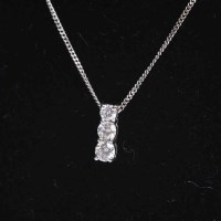 Lot 1688 - DIAMOND THREE STONE PENDANT the three...