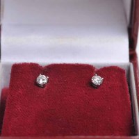 Lot 1689 - PAIR OF DIAMOND STUD EARRINGS each set with a...