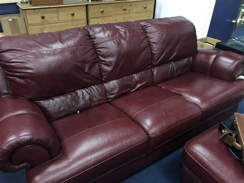 Lot 391 - A THREE SEATER RED LEATHER SETTEE WITH MATCHING ARMCHAIR AND FOOTSTOOL