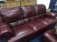Lot 391 - A THREE SEATER RED LEATHER SETTEE WITH MATCHING ARMCHAIR AND FOOTSTOOL