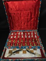 Lot 379 - A CASED EASTERN ALABASTER AND HARD STONE CHESS SET