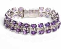 Lot 1698 - SILVER AMETHYST BRACELET set with two rows of...