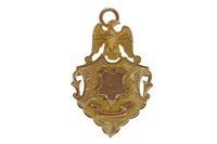 Lot 276 - A GOLD SHIELD PENDANT WITH EAGLE MOTIF