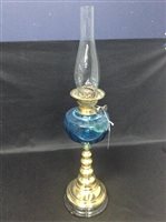 Lot 491 - A BRASS COLUMN OIL LAMP WITH BLUE GLASS RESERVOIR