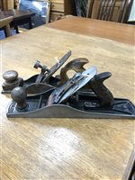 Lot 200 - AN EARLY WOOD PLANE WITH A STANLEY WOOD PLANE AND AN ENGINEERS LEVEL