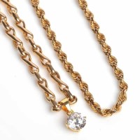 Lot 1736 - NINE CARAT GOLD CHAIN with crossed oval links...