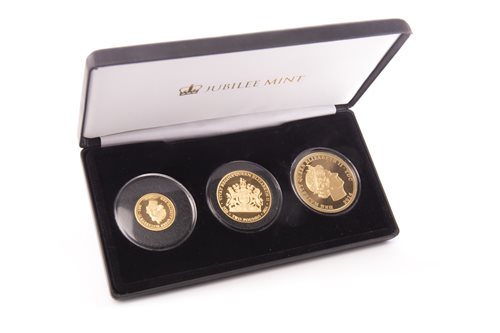 Lot 512 - A GOLD THREE POUND COIN SET