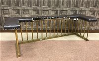 Lot 981 - A LATE VICTORIAN BRASS CLUB FENDER

with upholstered seat in brown leather (wide area of
damage), 178 cm wide 150-200