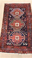 Lot 92 - AN EASTERN BORDERED RUG OF CAUCASIAN DESIGN