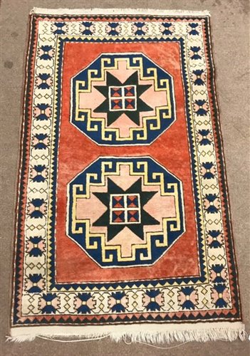 Lot 1002 - AN EASTERN BORDERED RUG OF CAUCASIAN DESIGN