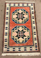 Lot 1002 - AN EASTERN BORDERED RUG OF CAUCASIAN DESIGN