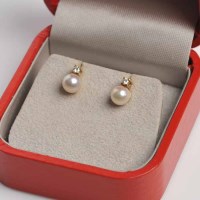 Lot 1756 - PAIR OF PEARL AND DIAMOND EARRINGS each with a...