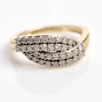 Lot 1759 - DIAMOND DRESS RING set with four overlapping...