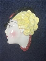 Lot 255 - A SET OF TWO ART DECO STYLE FACE WALL MASKS