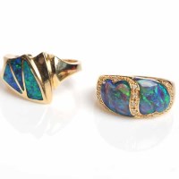 Lot 1785 - TWO FOURTEEN CARAT GOLD OPAL DRESS RINGS, both...