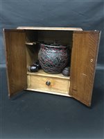 Lot 385 - A SMOKERS' OAK CABINET