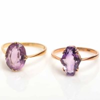 Lot 1809 - TWO AMETHYST RINGS one early twentieth century...