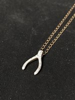 Lot 343 - A NINE CARAT DIAMOND WISHBONE PENDANT, on a 9ct gold chain