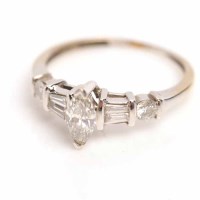 Lot 1837 - DIAMOND DRESS RING set with a central marquise...