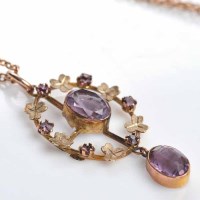 Lot 1863 - EDWARDIAN AMETHYST PENDANT of oval form, with...