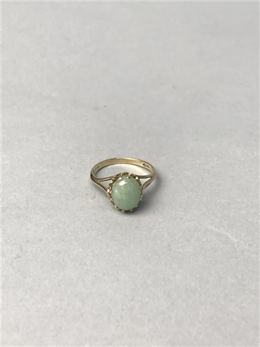 Lot 383 - A GREEN HARDSTONE RING