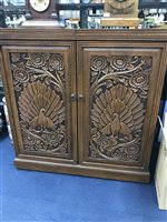 Lot 305 - A CARVED WOOD COCKTAIL CABINET