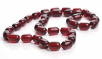 Lot 1895 - CHERRY RED BAKELITE BEAD NECKLACE with ovoid...