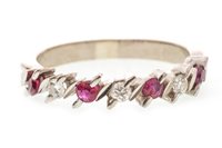 Lot 205 - A DIAMOND AND RED GEM SET BAND