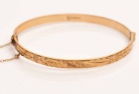 Lot 1913 - NINE CARAT GOLD BANGLE with engraved...