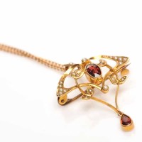 Lot 1916 - ART NOUVEAU GARNET AND SPLIT PEARL HOLBEIN of...