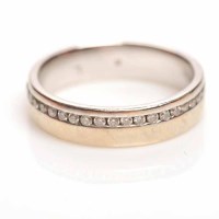 Lot 1926 - DIAMOND SET WEDDING BAND channel set with a...