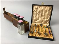 Lot 457 - A SET OF SILVER ENAMELLED TRAVELLING BOTTLES AND A TEA SPOON SET