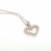 Lot 1937 - DIAMOND SET HEART MOTIF PENDANT in eighteen...