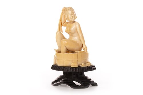 Lot 1077 - A CHINESE IVORY CARVING OF A FEMALE