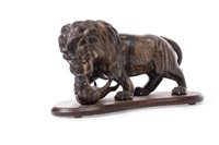 Lot 1138 - AN ANGLO-INDIAN HARDWOOD CARVING OF A LION AND PANTHER