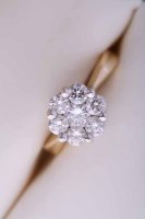 Lot 1982 - DIAMOND CLUSTER RING of flower form, set with...