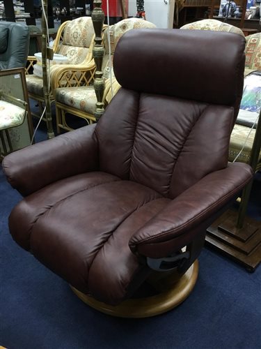 Lot 249 - A BROWN LEATHER ARMCHAIR AND FOOTSTOOL